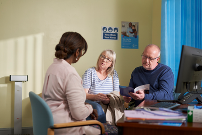 Photograph showing a doctors appointment with a couple