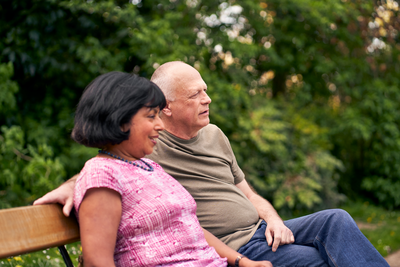 Photograph showing a couple sitting on a bench