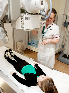 Photograph of Child having a chest x-ray