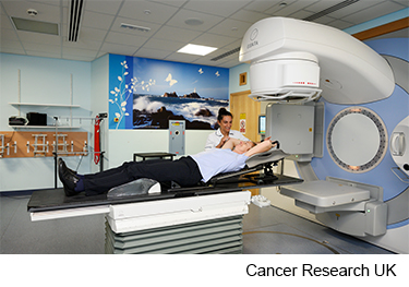 Photo of a women having radiotherapy for breast cancer