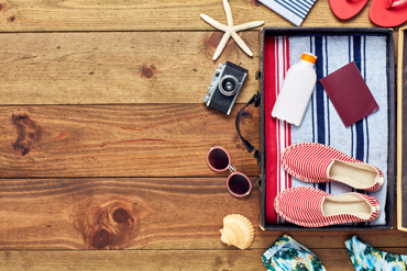 Photograph of open suitcase for travelling abroad.